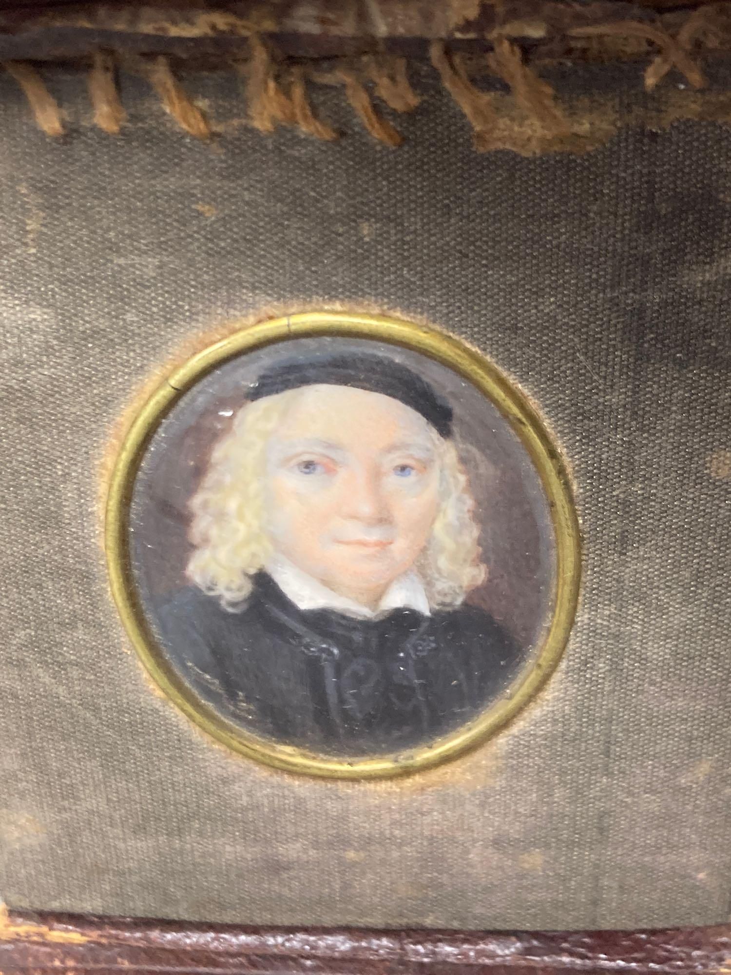 Five assorted miniatures of gentleman including one in yellow metal frame, largest being an oval portrait in a brown velvet frame, 5cm